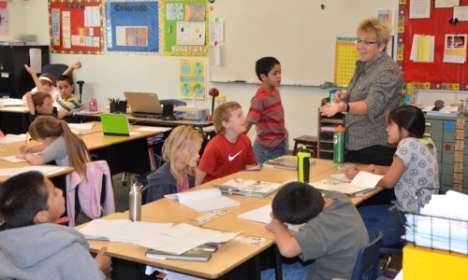 Yuma EA's Becky Lubbers guides her fourth-graders through a writing assignment at Morrison Elementary.
